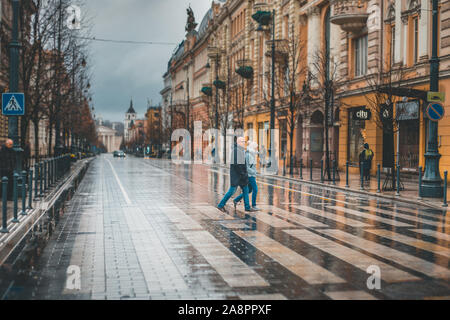 Vilnius, Lithuania - November 18, 2018: Late autumn in the city - rainy streets, passersby rush - Gediminas Avenue Stock Photo