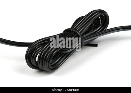 Black electric cable on white background. High resolution photo. Full depth of field. Stock Photo