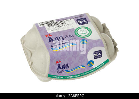 Stockholm, Sweden - November 10, 2019: A small Swedish egg carton for six hen eggs labeled with the Ica brand isolated on white background. Stock Photo