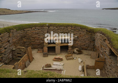 The famous prehistoric stone age dresser within one of the 5000 year old houses in the Neolithic village of Skara Brae, Orkney, Great Britain Stock Photo