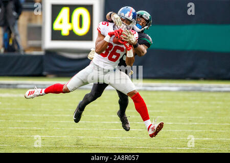 East Rutherford, New Jersey, USA. 10th Nov, 2019. New York Giants wide receiver Darius Slayton (86) makes the catch against New York Jets cornerback Arthur Maulet (23) during the NFL game between the New York Giants and the New York Jets at MetLife Stadium in East Rutherford, New Jersey. Christopher Szagola/CSM/Alamy Live News Stock Photo