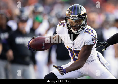 DETROIT, MI - SEPTEMBER 26: Baltimore Ravens wide receiver Marquise Brown  (5) cannot hold on to a pass in the end zone while Detroit Lions running  back Bobby Price (27) defends during