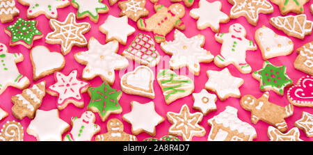Colorful gingerbread cookies on pink background Stock Photo
