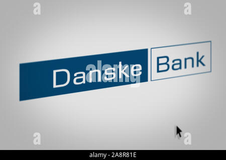 Logo of the public company Danske Bank displayed on a computer screen in close-up. Credit: PIXDUCE Stock Photo