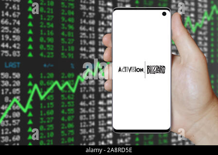 Logo of public company Activision Blizzard displayed on a smartphone. Positive stock market background. Credit: PIXDUCE Stock Photo