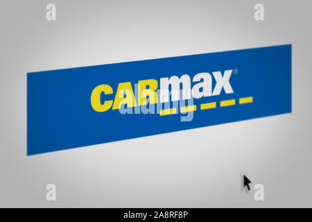 Logo of public company Carmax Inc displayed on a smartphone. Flag of ...