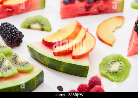 delicious dessert with watermelon, nectarine and berries on white background Stock Photo