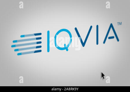 Logo of the public company IQVIA Holdings Inc. displayed on a computer screen in close-up. Credit: PIXDUCE Stock Photo