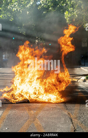 Santiago de Chile. Chile. 06 November 2019. People protesters preparing Barricades with fire and objects in Providencia neighborhood at Santiago streets Stock Photo