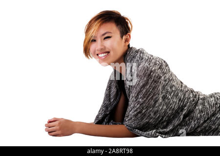 Smiling Slim Asian Woman Gray Sweater Reclining On White Background Stock Photo