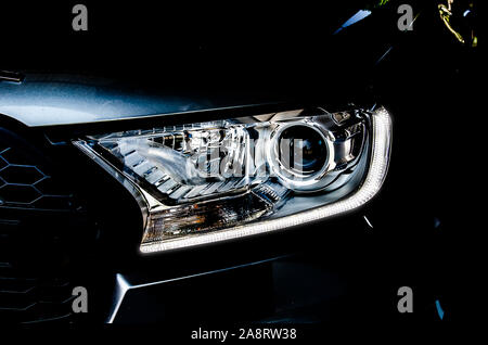 Modern Car exterior details.Headlight of a modern sport car Stock Photo