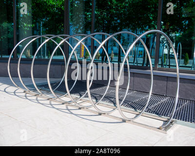 Voronezh, Russia -  June 11, 2019: Bicycle parking in the form of a long metal spiral Stock Photo