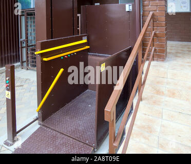 Voronezh, Russia -  June 11, 2019: Elevator lift for people with reduced mobility at the entrance of the house Stock Photo