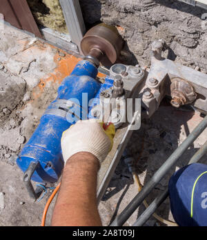 Drilling a large hole with a diamond drilling rig Stock Photo