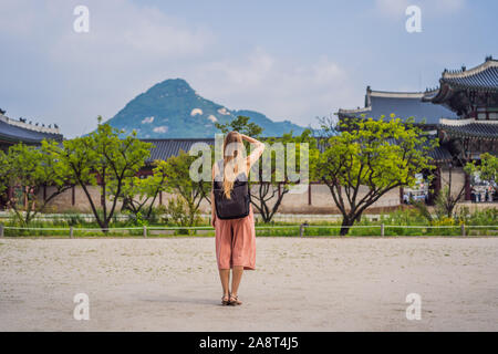 Woman tourist in korea. Gyeongbokgung Palace grounds in Seoul, South Korea. Travel to Korea concept Stock Photo