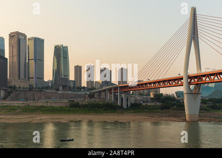 Chongqing, CHINA - May 10, 2019 : Cityscape and skyline of downtown near Chongqing Dongshuimen Bridge and Yangtze river. Chongqing, China. Stock Photo