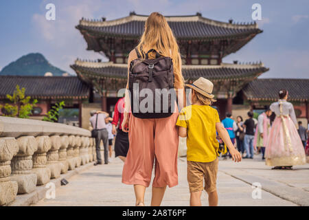 Mom and son tourists in Korea. Gyeongbokgung Palace grounds in Seoul, South Korea. Travel to Korea concept. Traveling with children concept Stock Photo