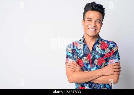 Portrait of happy young Asian man smiling with arms crossed Stock Photo