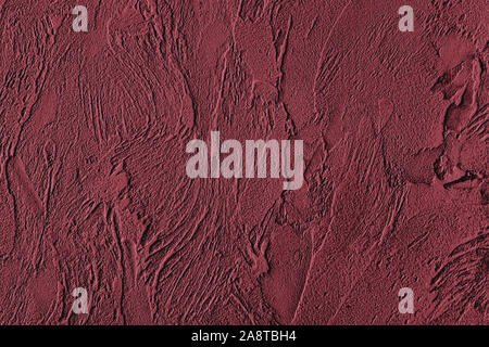 Dark red colored low contrast Concrete textured background with roughness and irregularities to your design or product. Color trend concept. Stock Photo
