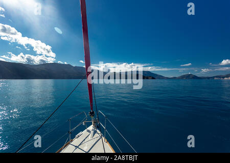 View from the bow of the yacht to the sea and mountains Stock Photo