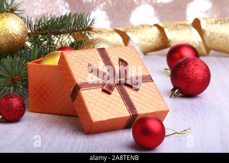 Christmas decoration with gift boxes, colorful christmas balls and christmas tree on a blurry, sparkling and fabulous background.. Stock Photo