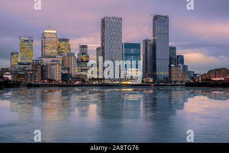 Canary wharf cityscape. The buildings are reflected in Thames river’s water. Canary wharf is the business districet in London City UK. Stock Photo