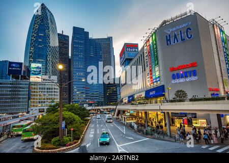 On the left Mode Gakuen Cocoon Tower by Kenzo Tange and Noritaka Tange. Shinjuku district, Tokyo, Japan, Asia Stock Photo