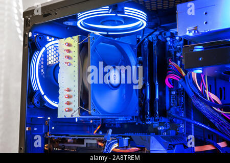Large processor cooler on a modern gaming computer with RGB illumination. Detail of processor, memory, graphics card and coolers. Stock Photo