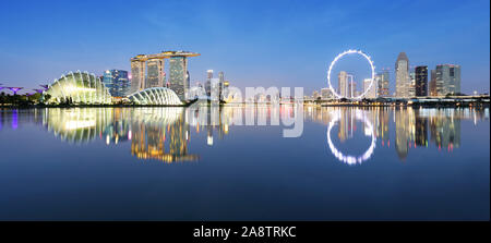 Panoramic image of Singapore skyline at night. Stock Photo