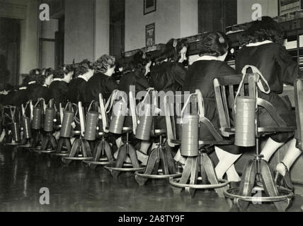 Telephone switchboard operators ready with antigas masks, Venice, Italy 1940s Stock Photo