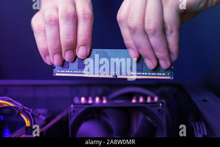 Installing a memory module in your computer. A simple module for a personal computer. Stock Photo
