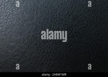 Black fading leather background with a bluish touch Stock Photo