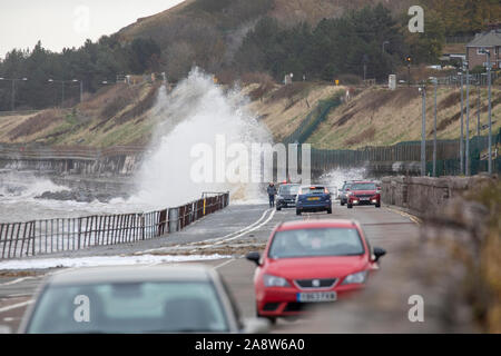 Colwyn Bay, North Wales, UK. 11th November 2019. Uk Weather  Wet and windy at for many today with dangerous conditions on coastal areas with high tides causing huge waves as seen at Colwyn Bay in North Wales Credit: DGDImages/Alamy Live News Stock Photo