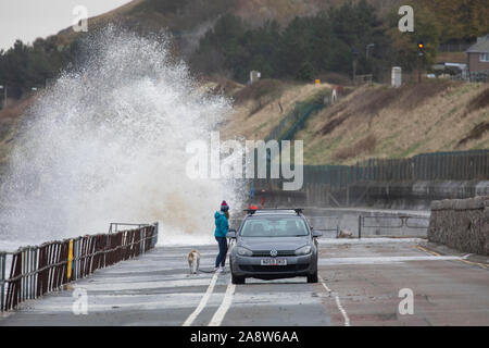 Colwyn Bay, North Wales, UK. 11th November 2019.UK Weather Wet and windy at for many today with dangerous conditions on coastal areas with high tides causing huge waves as seen at Colwyn Bay in North Wales Credit: DGDImages/Alamy Live News Stock Photo