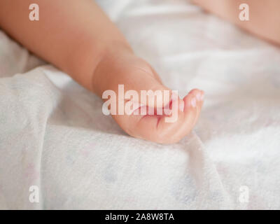 Babys hand. Close-up. A place to write. Placing text. defocusing. Stock Photo