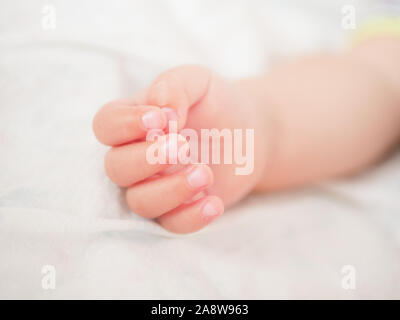 Babys hand. Close-up. A place to write. Placing text. defocusing. Stock Photo