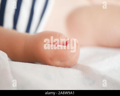 Babys hand. Close-up. A place to write. Placing text. defocusing. Stock Photo