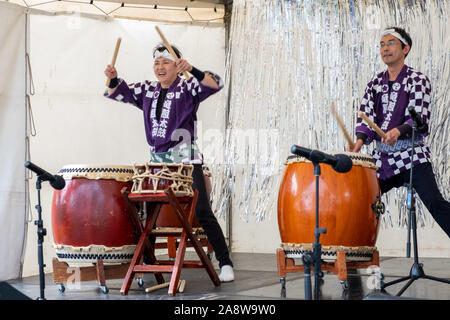 Melbourne, Australia - October 6, 2019: Two Japanese taiko drummers performing live at street festival Stock Photo