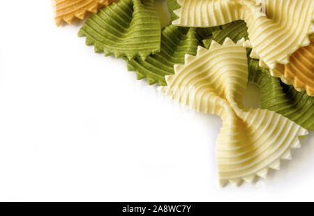ripped bow pasta,  tri-colored  isolated on white background for copy space or text overlay Stock Photo