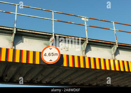 Railway bridge height restriction 4.65 m headroom warning sign Stock Photo