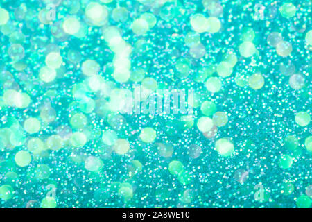 Mint festive background with sparkles in the bokeh. The concept of the celebration, the day of St. Valentine, New Year, birthdays, ceremonies, events, etc. Stock Photo