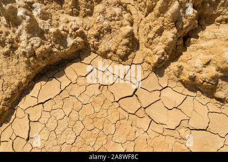 Clay sandy earth parched and cracked Stock Photo