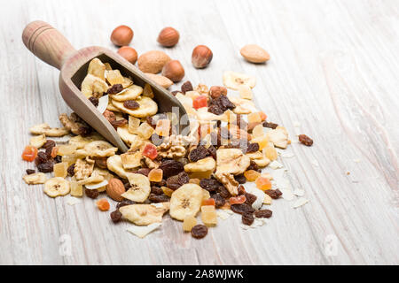 Bunch of dried fruits mix on wooden table Stock Photo