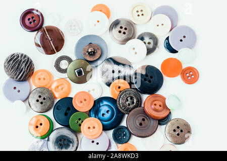 Colorful sewing buttons on white background closeup with copy space for text Stock Photo