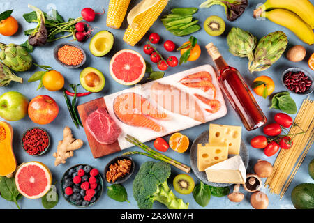 Food, overhead photo of many different products, with meat, fish, chicken and shrimps, vegetables and fruits, legumes, wine, pasta and cheese Stock Photo