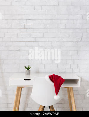 Santa's office after Christmas with workplace over bricks wall Stock Photo