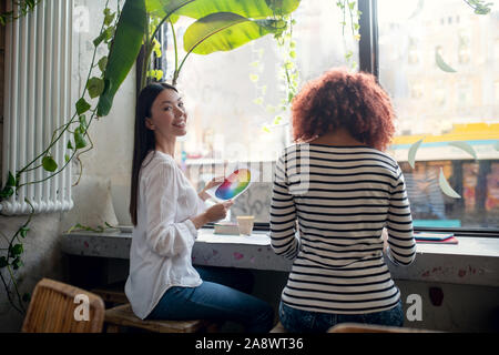 Two fashion designers creating new project having discussion Stock Photo
