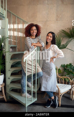 Two successful businesswomen opening their own coffee shop Stock Photo