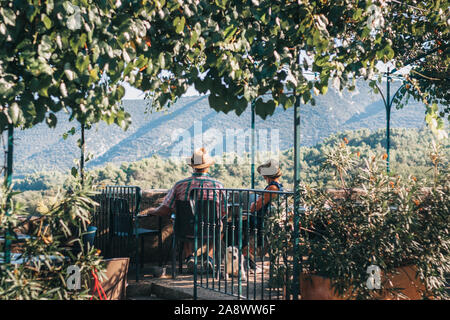 Lacoste, Vaucluse, Provence-Alpes-Cote d'Azur, France, September 25, 2018: Tourists on the terrace in the restaurant with an amazing breathtaking view Stock Photo