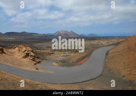 Road in Timanfaya National Park in Lanzarote,Canary Islands,Spain. The spectacular volcanic landscape background. Stock Photo